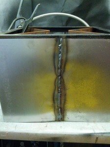 Kind of ugly weld, but it holds well and did not distort the thin sheetmetal.